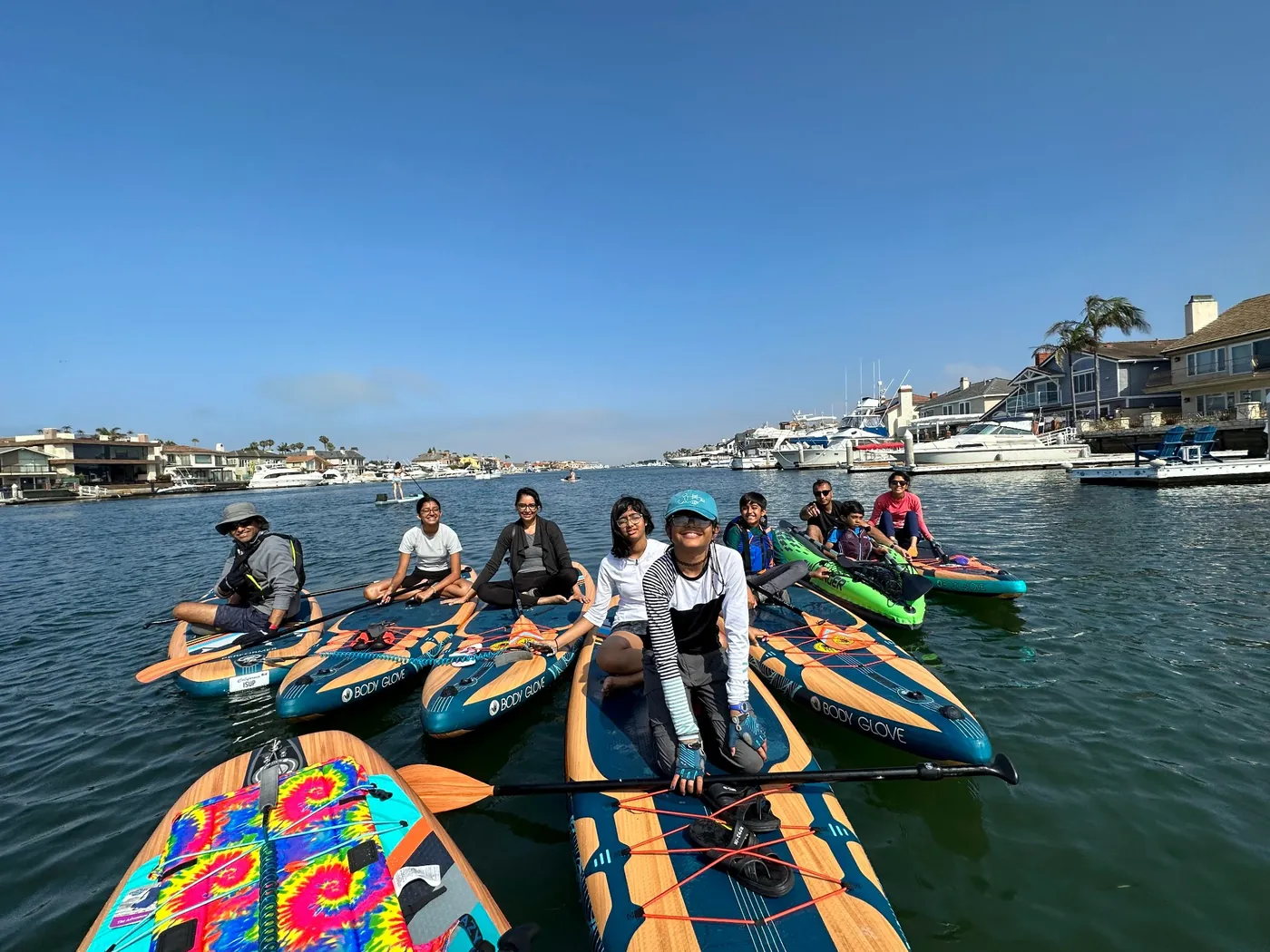 ASAN community members paddleboarding together